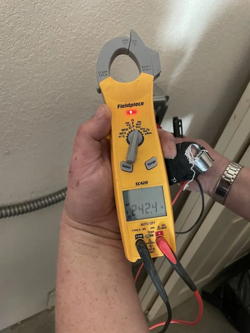 Voltage testing with clamp meter during Circuit Breaker Repair in West Valley City